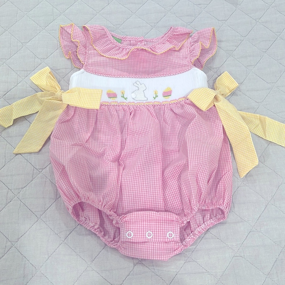 Beautiful Easter outfit. Yellow bows tie at the sides. Smocking on the front.